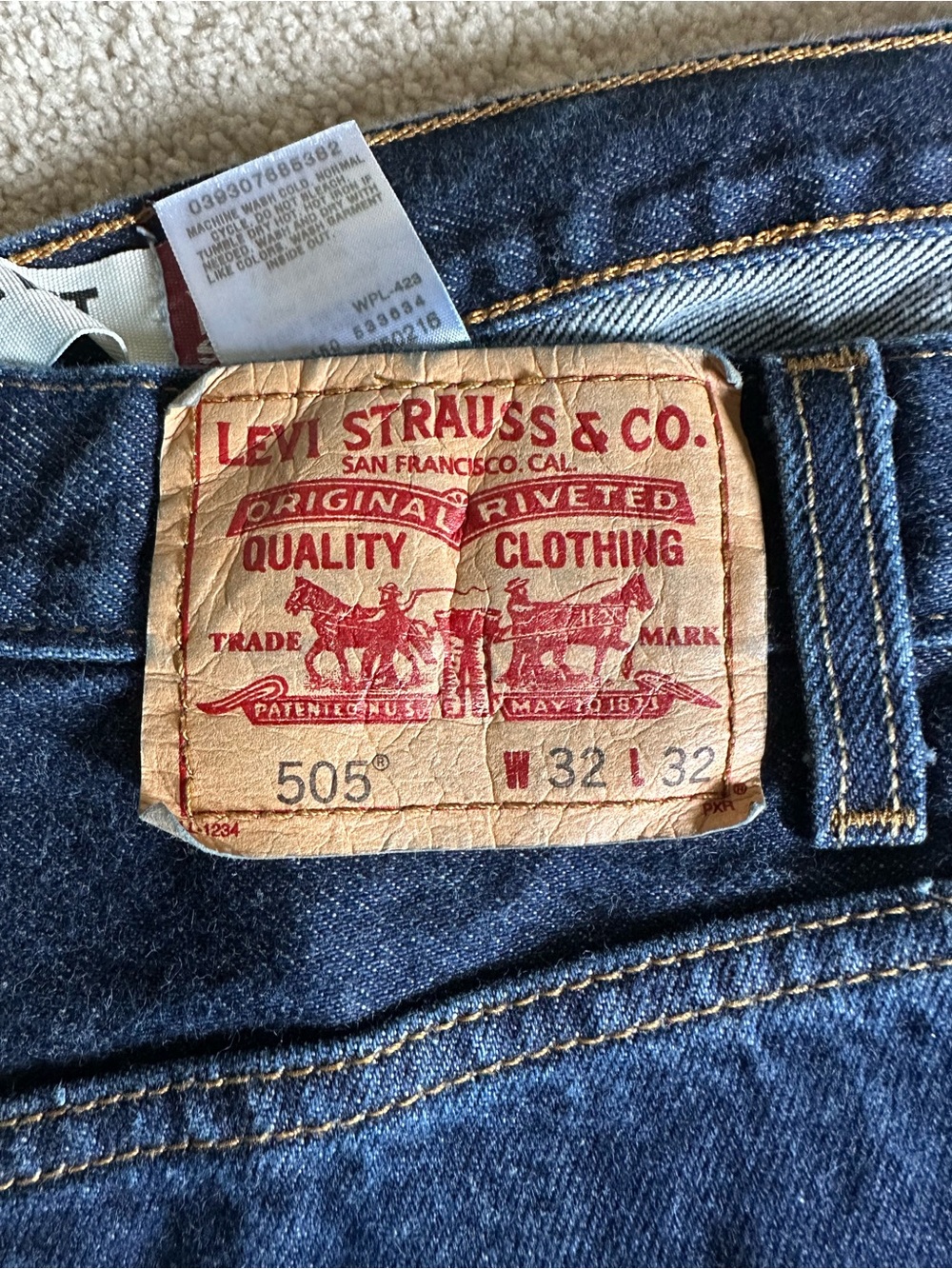 Levi's 505 Straight Jeans — Dark Indigo with Tan Patch